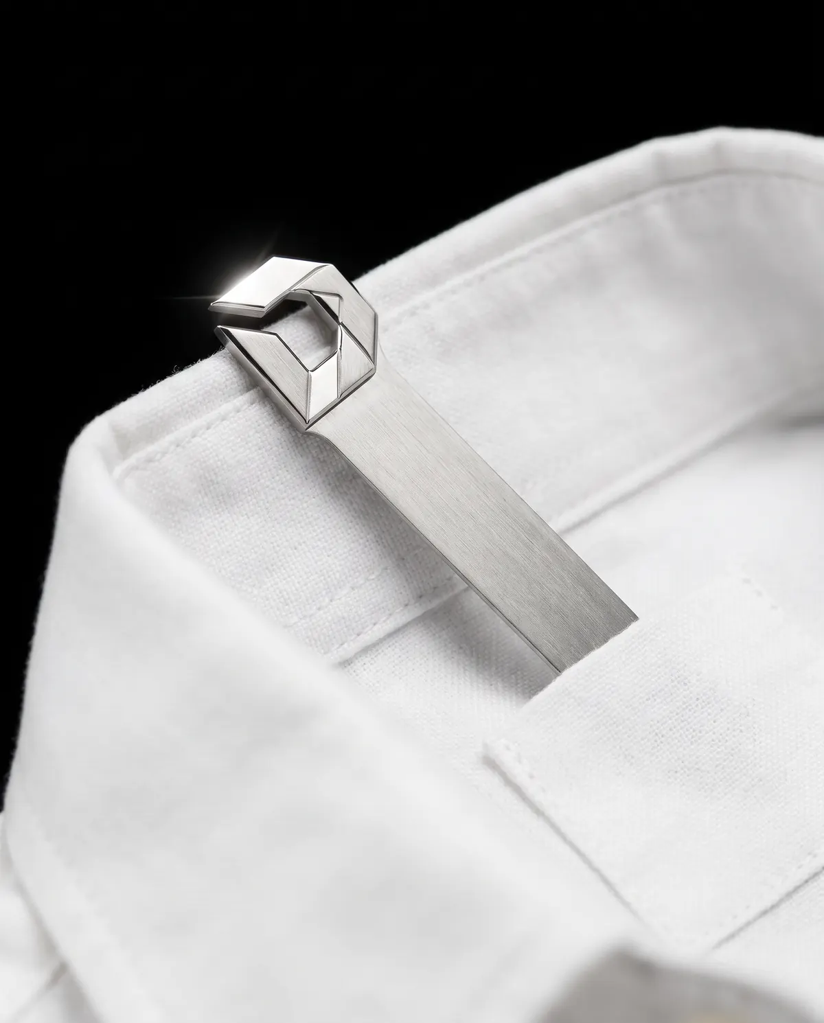 Close up of the oxford shirt: the collar stays, in stainless steel.